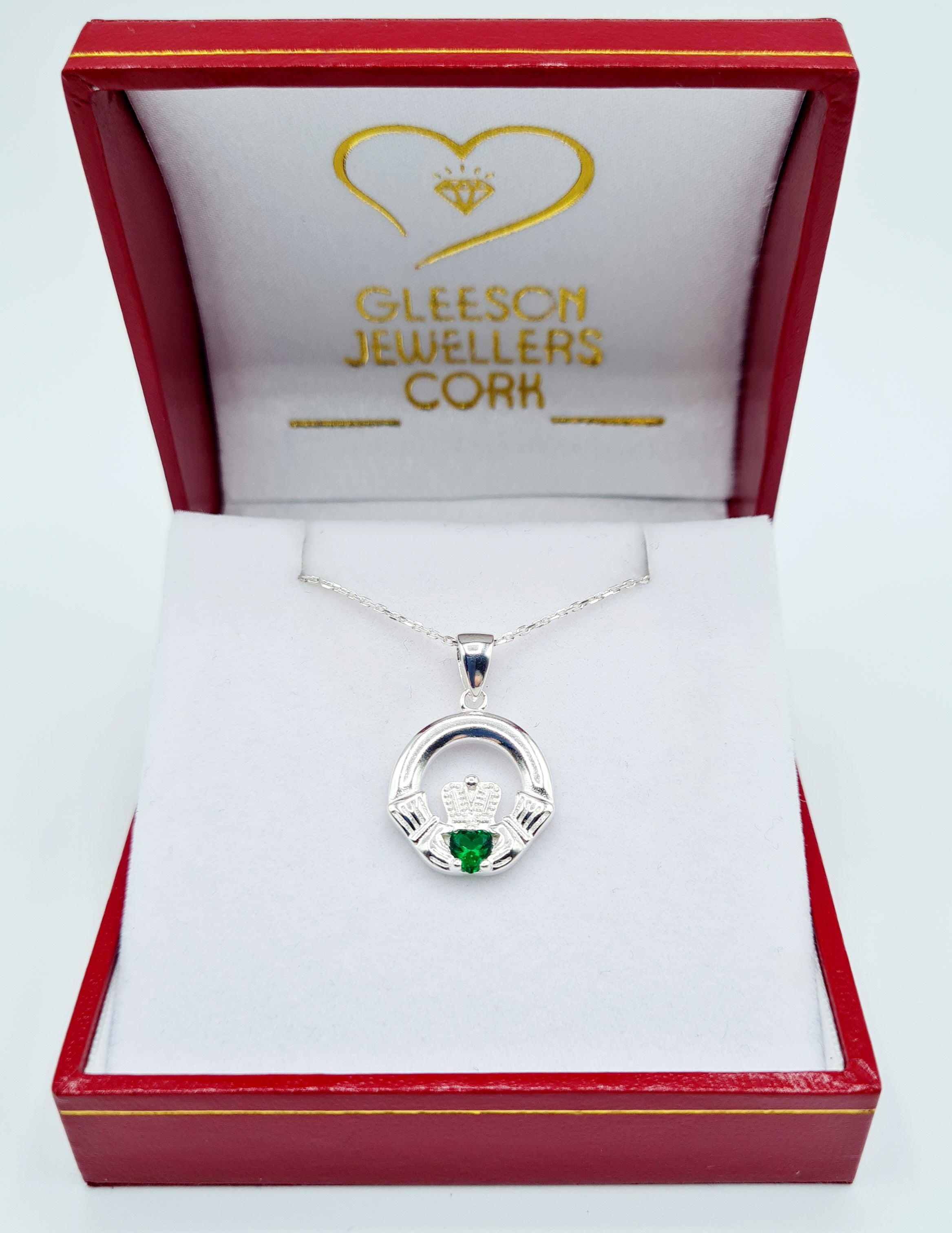 Claddagh Pendant set with a repeating pattern of CZ and Emerald.