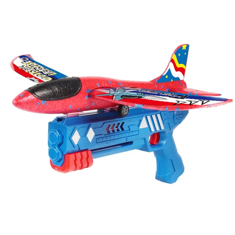 Brinquedo de avião planador vermelho com lançador azul, exibindo detalhes coloridos e design aerodinâmico