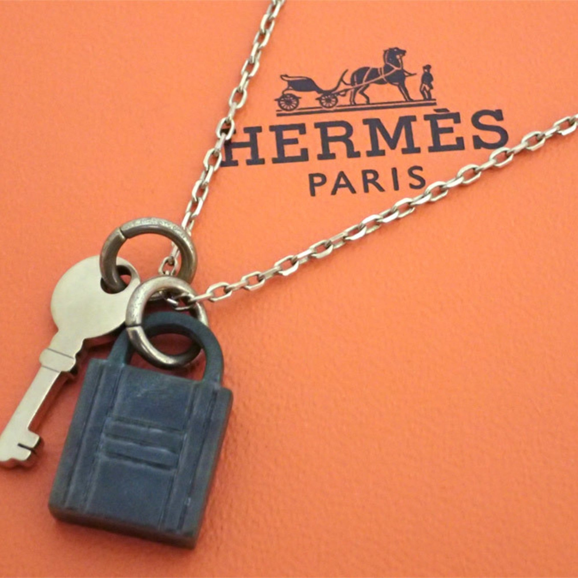 Image of HERMES necklace amulet padlock metal gold/khaki gray unisex