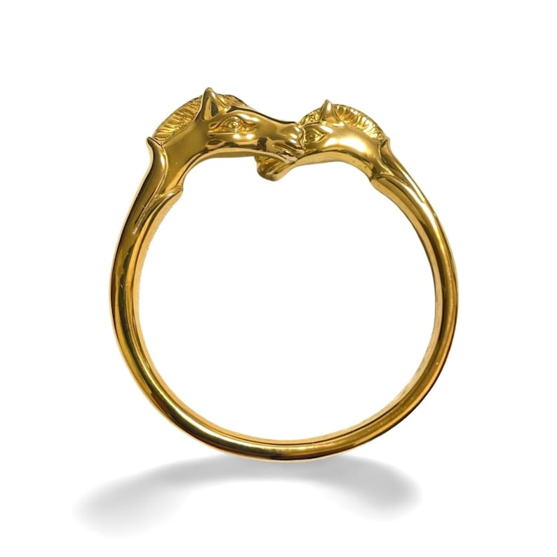 Image of HERMES Vintage golden double horse head design bangle, bracelet
