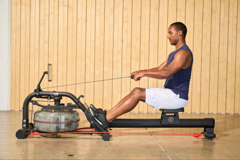 A man doing Pilates workout on the LIT Strength Machine