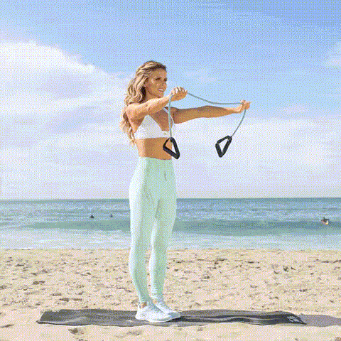 Image of woman doing band lat pull using resistance bands with handles