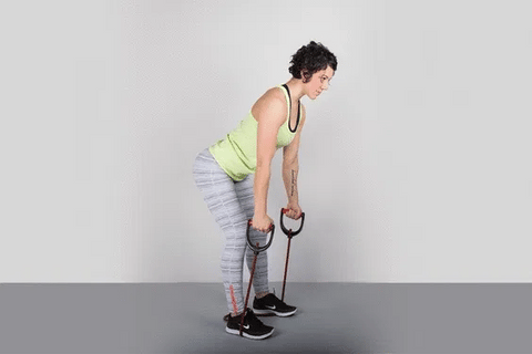 A woman doing bent over row using resistance bands