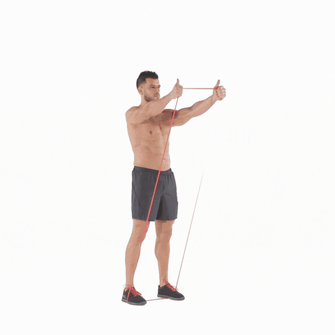 A man doing front raise using resistance bands
