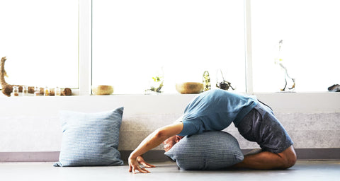 A woman performing Iyengar yoga