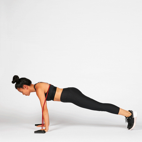 Image of woman doing push up with the help of resistance bands