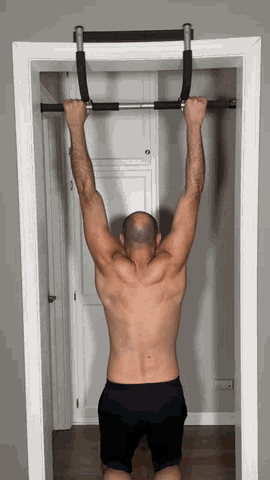 A man doing warmup exercise - scapular pull-up