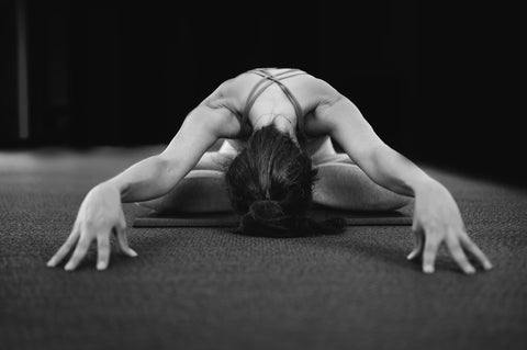 A woman doing Yin yoga
