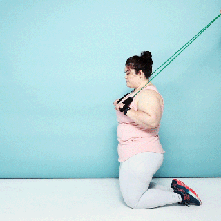 Image of woman doing kneeling crunch using resistance bands