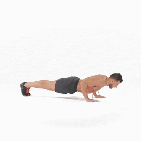 A man doing resistance band push-up