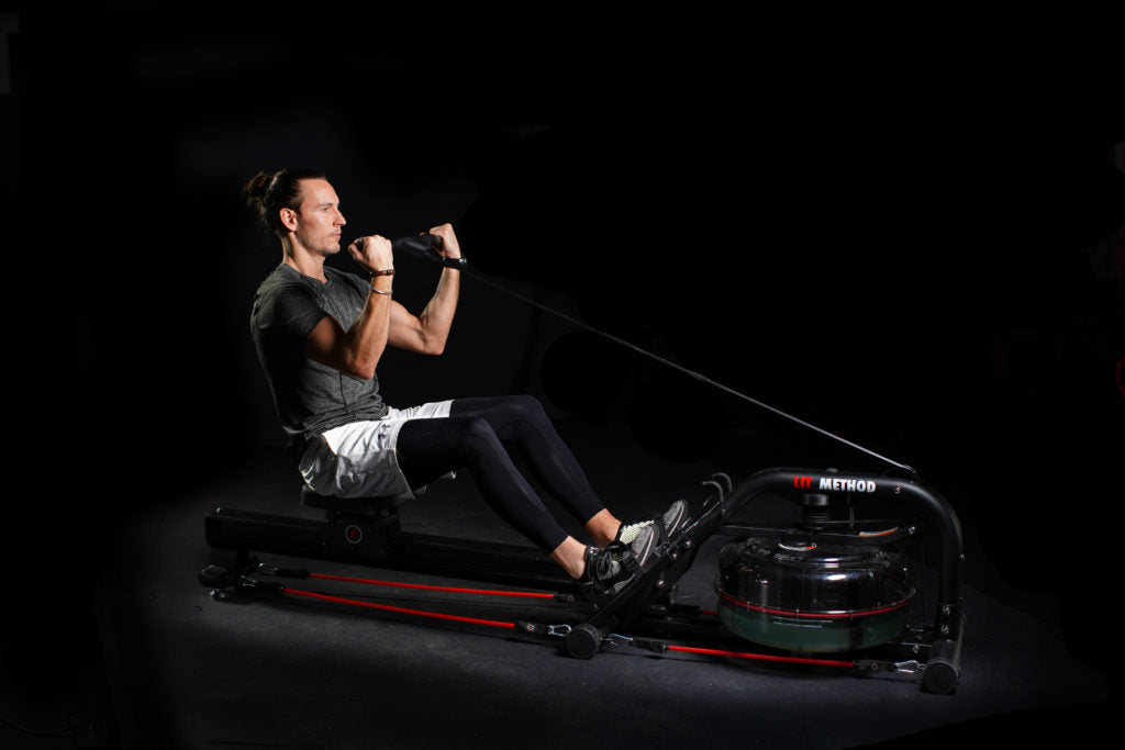 A man doing bicep curl on the LIT Strength Machine