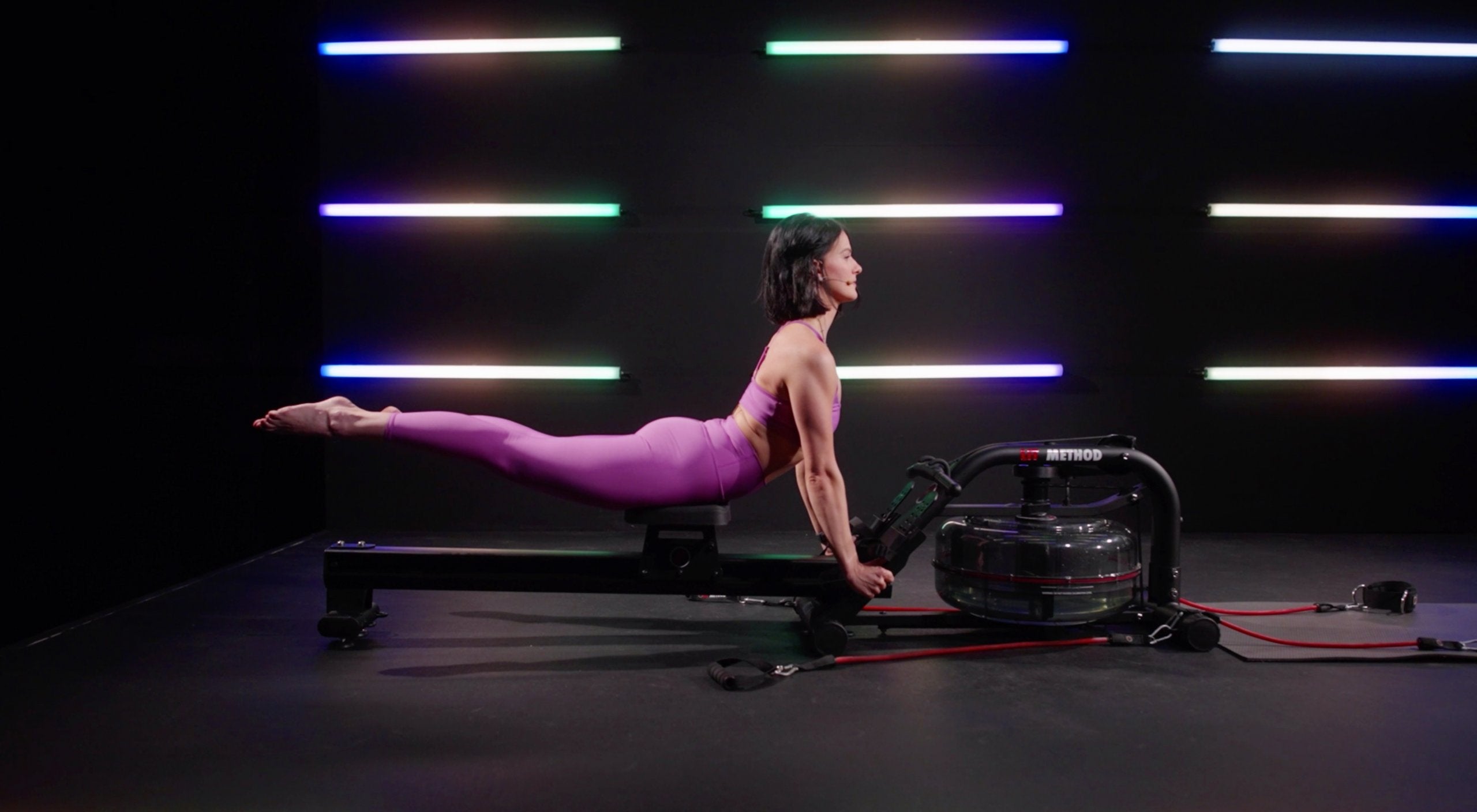 Woman doing Pilates workout on the LIT Strength Machine