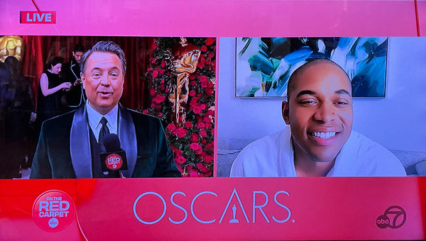 Caspian art in background behind Kelvin Harris on The Oscars Red Carpet Televised Event