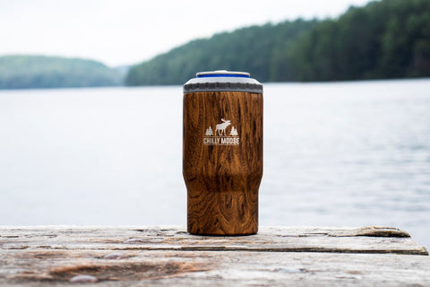 Brent 5-in-1 woodland color tumbler on a lake front dock with a can in it. 