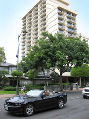 Luana Waikiki exterior view with black mustang convertible