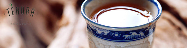 Pu-Erh tea liquid in a beautiful porcelain teacup