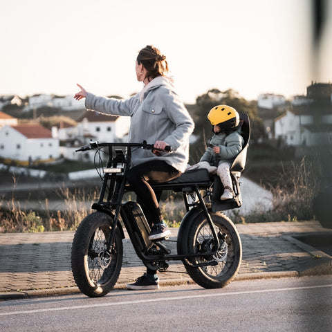 50 Rebels electric bicycle with child seat with a child