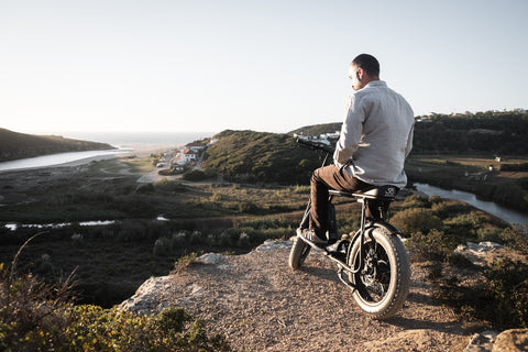 Men in the top of a hill with a 50 Rebels e-bike