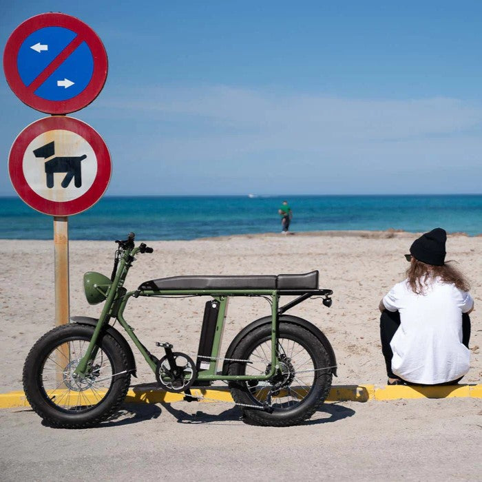 Young man at the beach with a MK e-bike