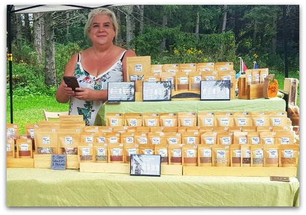 Lex selling spices at a farmer's market