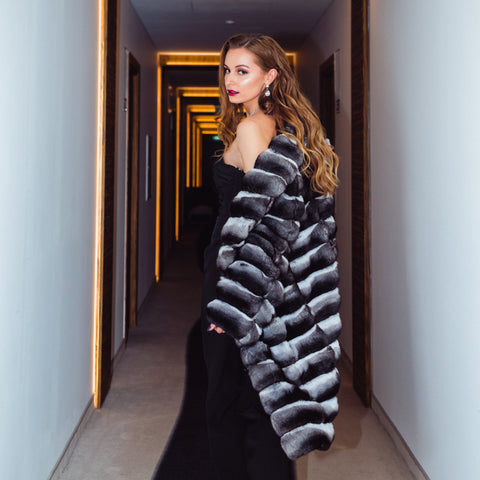 A Woman In Black Long Dress Wearing Natural Chinchilla Fur Coat