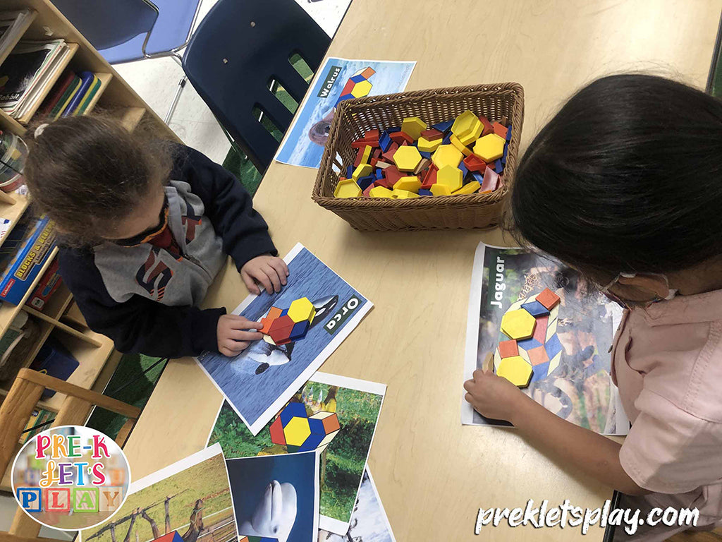 Preschool boy and girl playing pattern block math activities during small group play