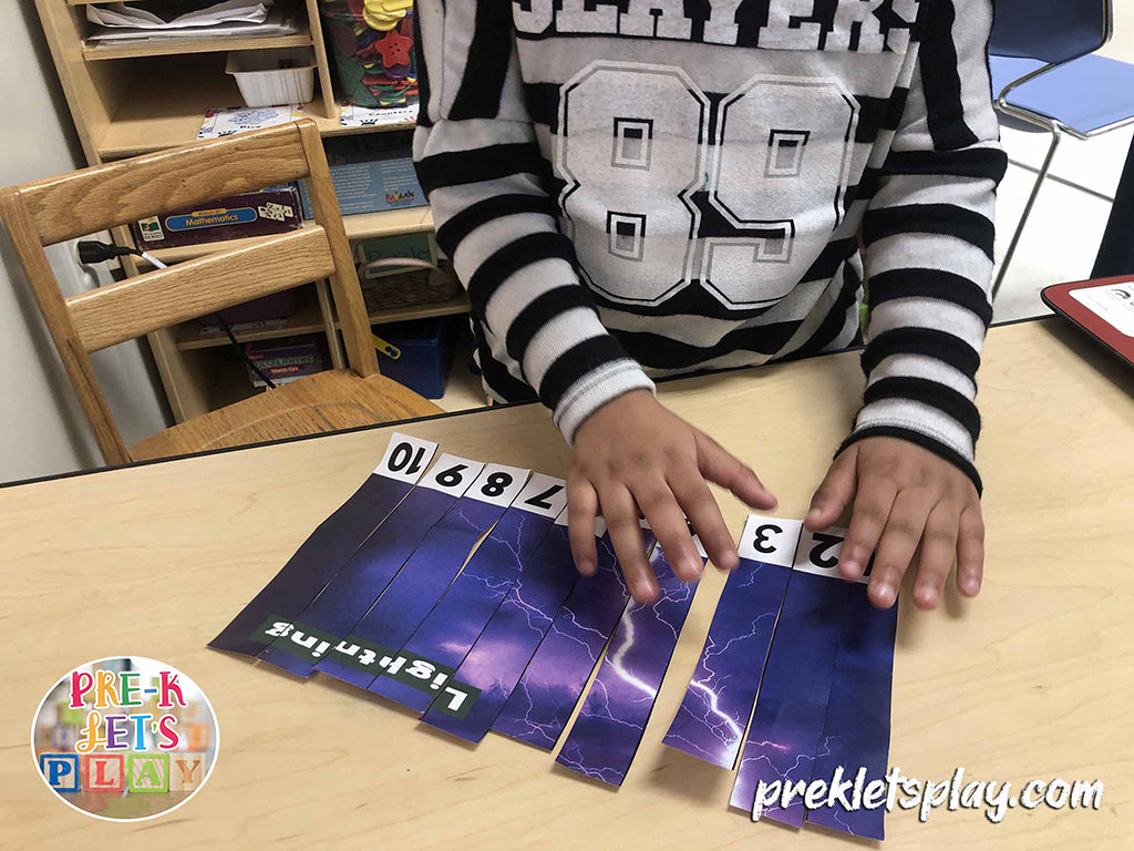 Preschool kid using their fine motor skills to complete the number order of this lightning weather game.