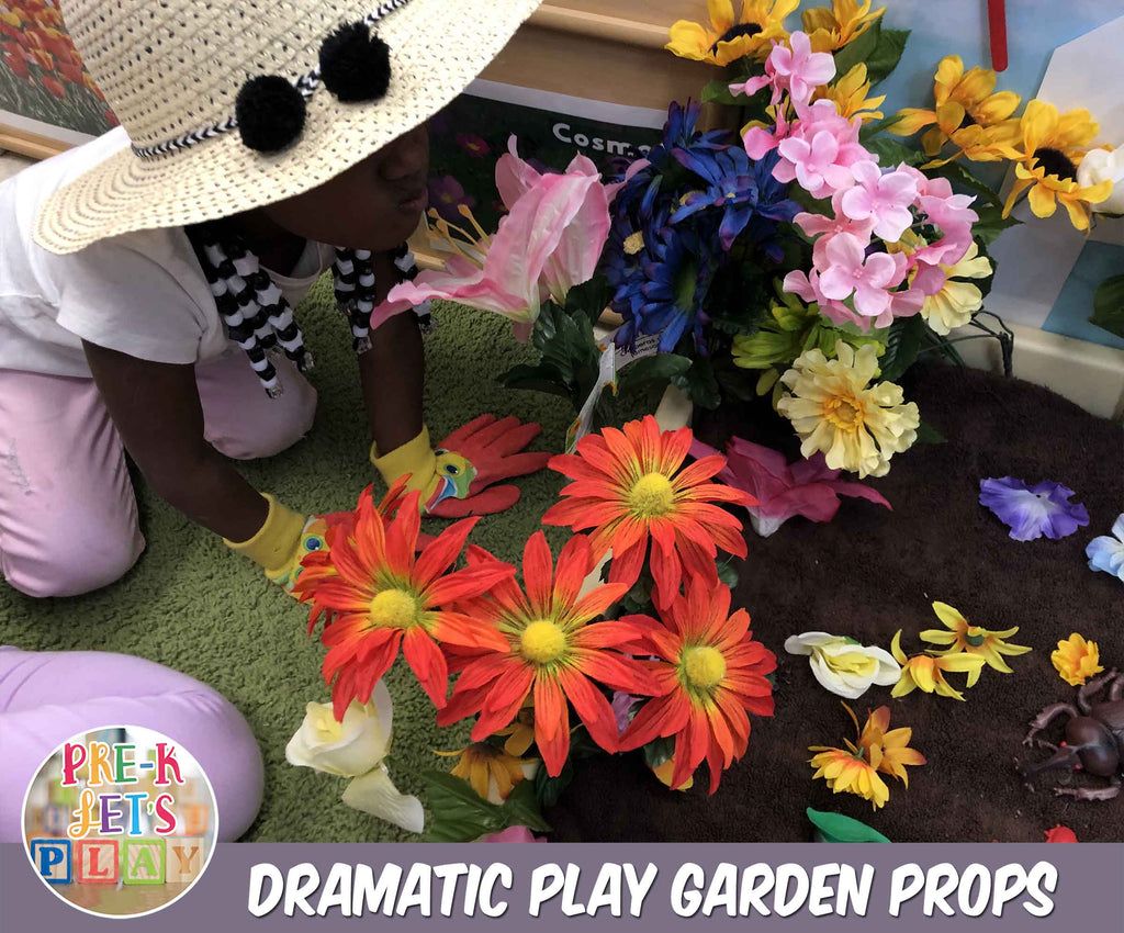 This child loves pretending to smell the fake flowers in the pretend play garden. 