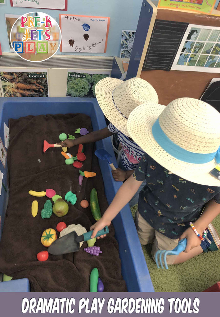 These Children in dramatic play area using gardening tools to pretend to dig out soil and practice growing pretend toy fruits and vegatables.