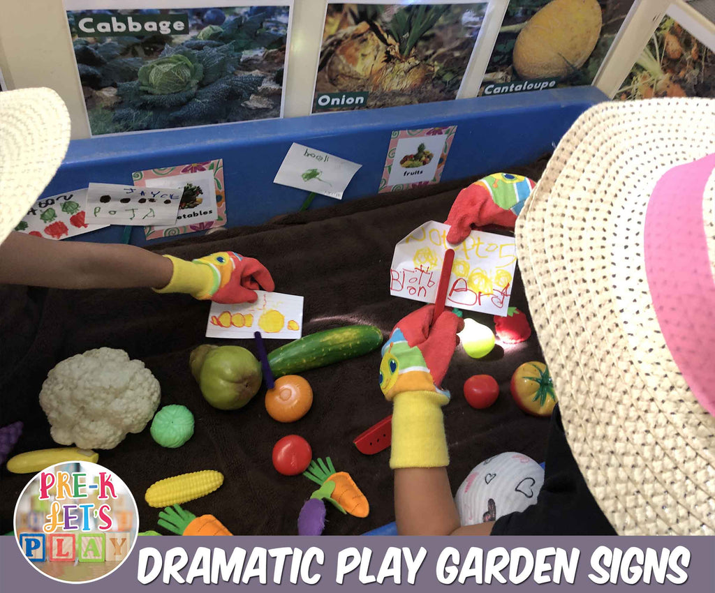 Children enjoyed making gardening signs of their favorite fruits and vegetables. Here are two preschoolers pretending to be gardeners by placing their signs next to some toy vegetables and fruits props.