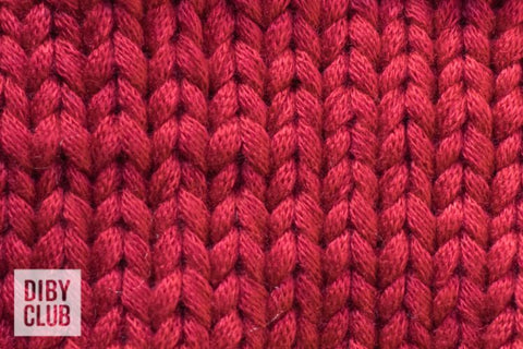 Close up of red knit fabric.
