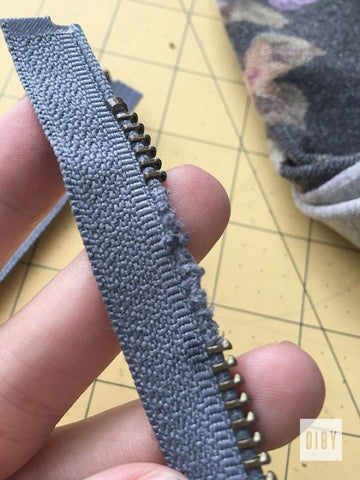 Zipper with teeth removed