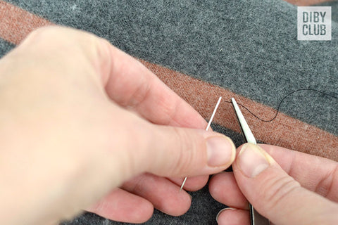 Tweezers threading a needle