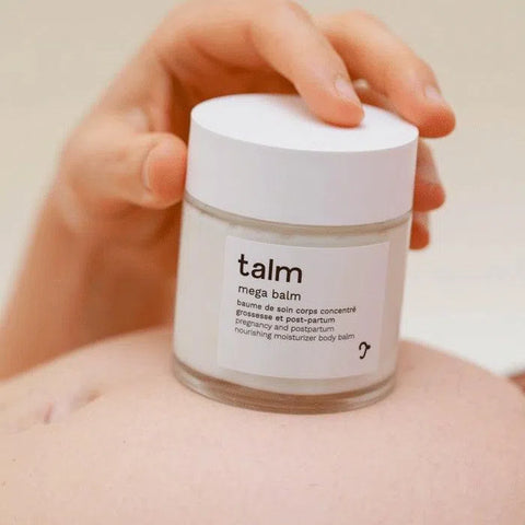Talm moisturizing face and body balm against stretch marks for pregnancy and postpartum on pregnant woman's stomach