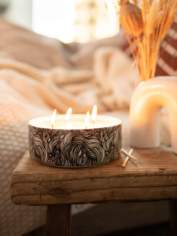 Big Scented Candle in Designed Ceramic Vessel featuring intriguing ink lines. On a wooden table. Cozy Interior