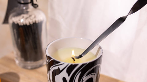 Extinguishing an Inkrypt Candle with a Wick Dipper