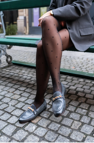 Patterned tights and loafers