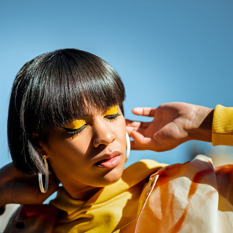 An image of a woman dressed all in yellow.