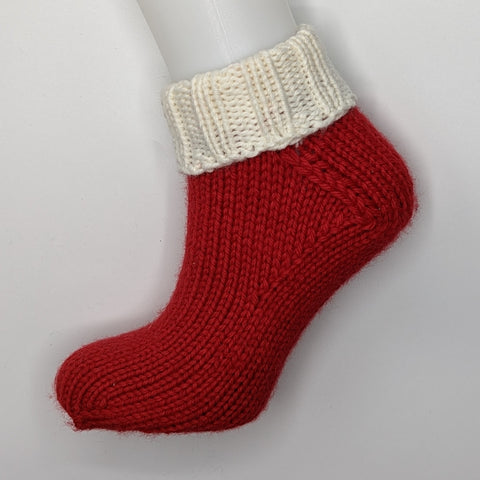 Red and white hand knitted sock