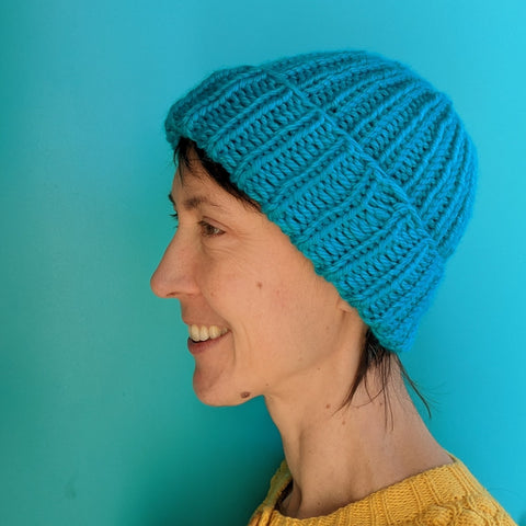 Person wearing a hand knitted hat