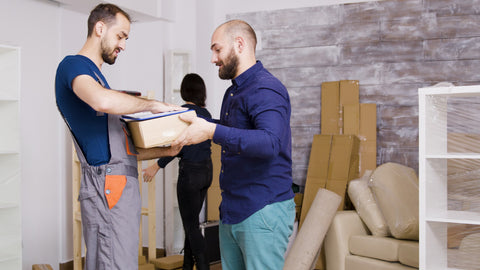 delivery service arriving with boxes and documents to be signed, showed furniture pick up and delivery service Auckland