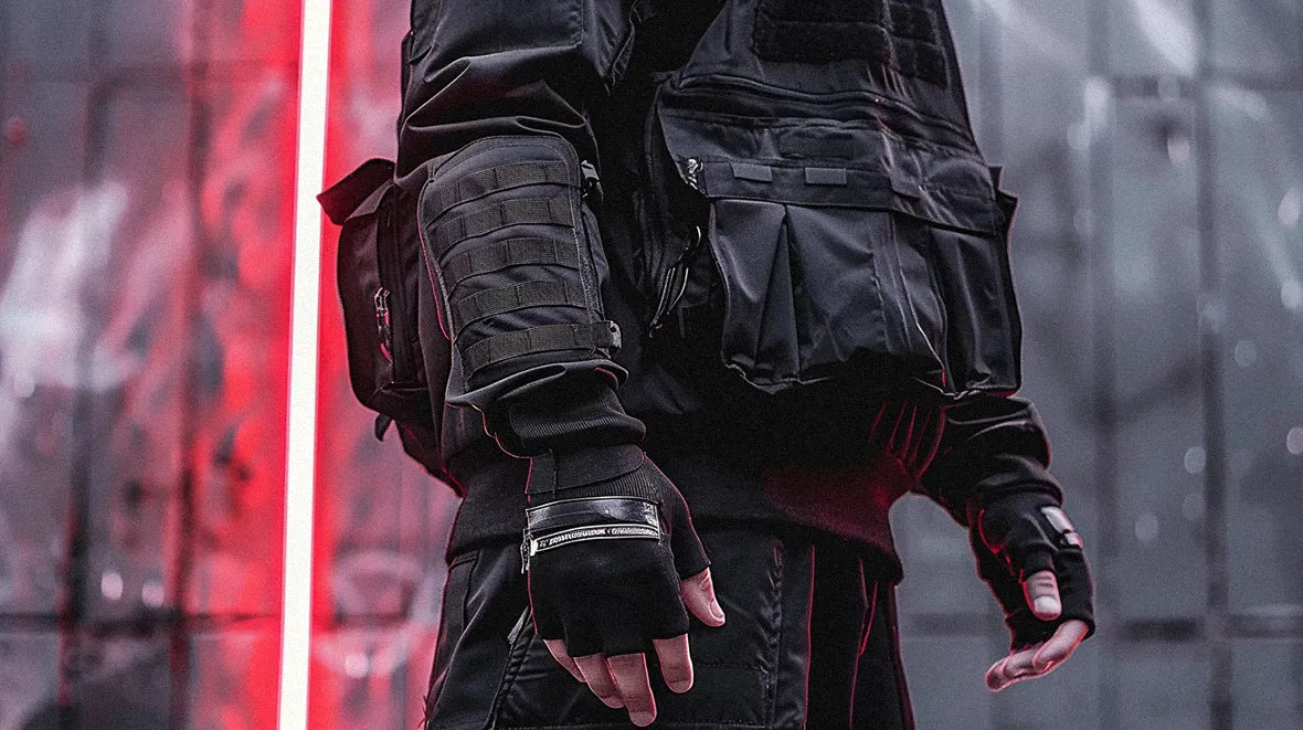 A pair of techwear fingerless gloves, detailed with armored padding and Velcro straps, conveys a sense of urban techwear style.