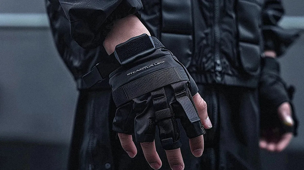 modern fingerless gloves with a protective design, crafted in black material, emphasizing their use in tech or combat situations.