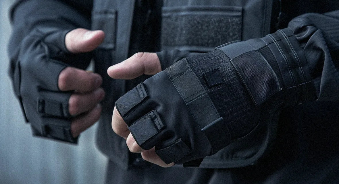 a man wearing techwear fingerless gloves