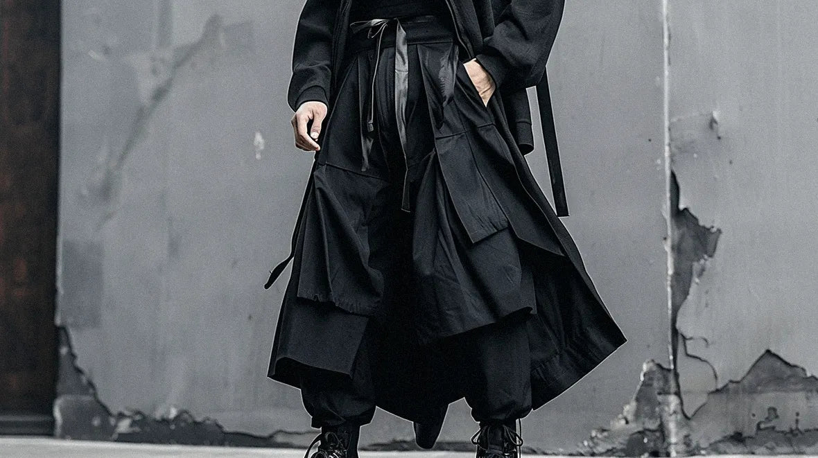 man in all black outfit with hakama pants