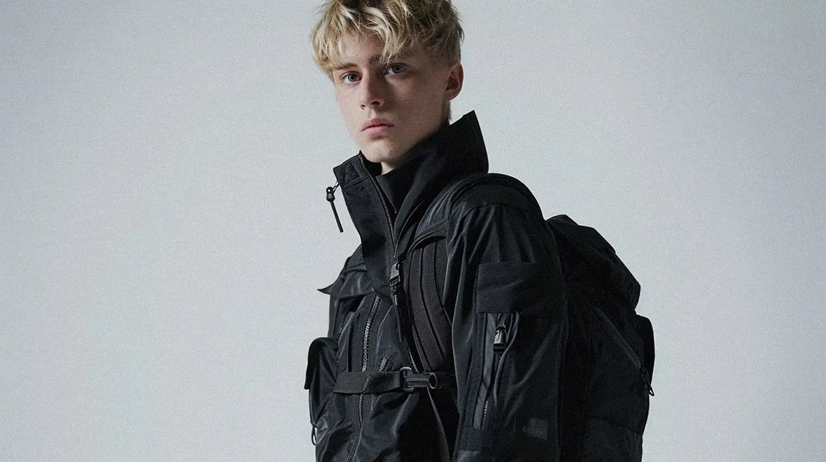 blonde man in techwear outfit wearing a techwear bag