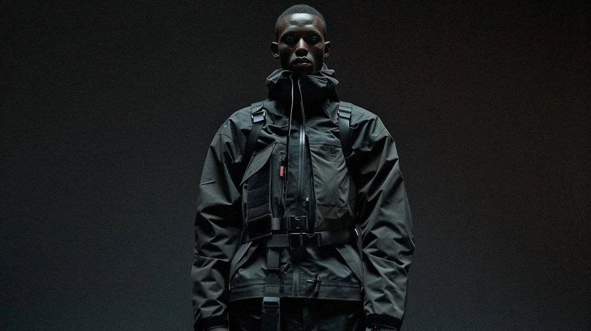 a black man wearing a techwear belt