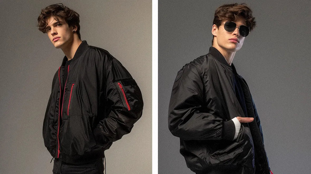 The image features a modern street fashion look, highlighted by the men's black bomber jacket.