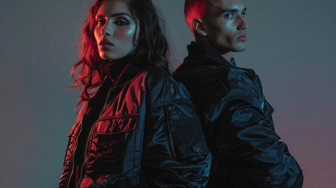 a woman and a man wearing techwear bomber jackets