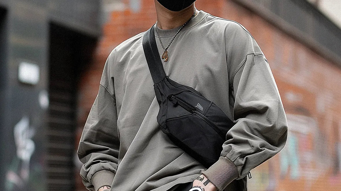 a man wearing a techwear fanny pack